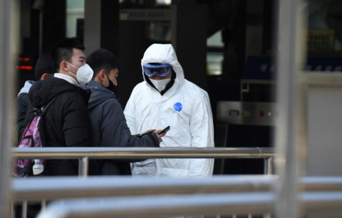 Medidas de seguridad Wuhan China, FOTO: AFP.